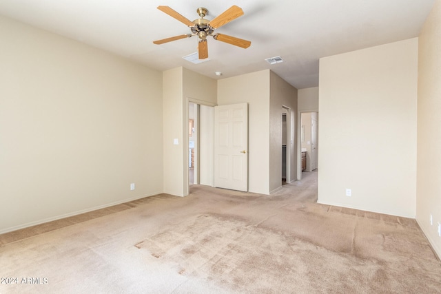 unfurnished bedroom featuring ceiling fan and light carpet