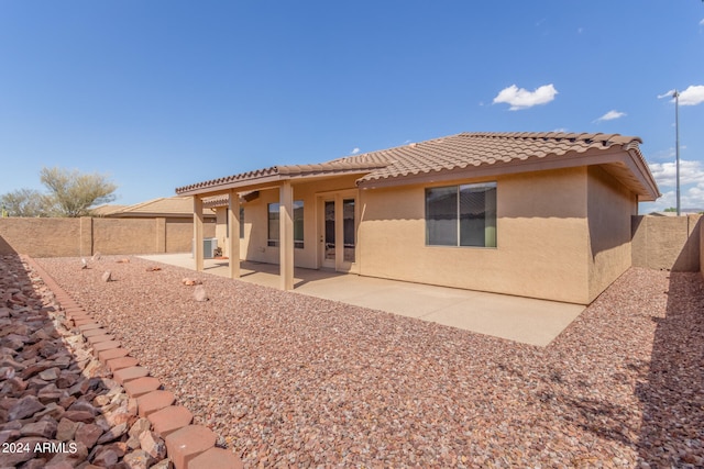 back of house with a patio area