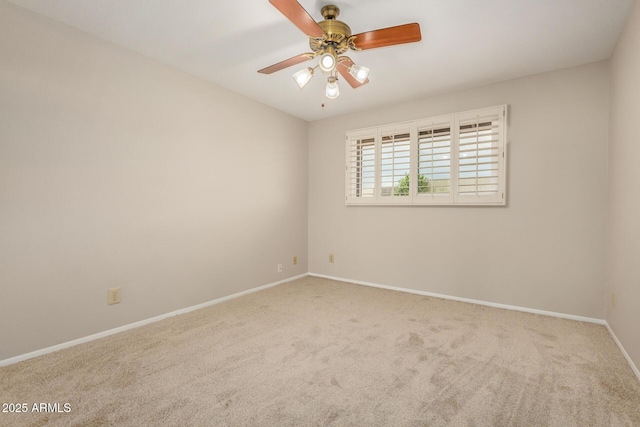 empty room with carpet floors, baseboards, and ceiling fan