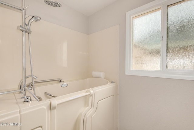 bathroom featuring a tub to relax in