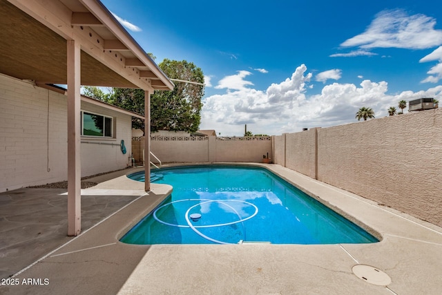 view of swimming pool featuring a patio and a fenced backyard