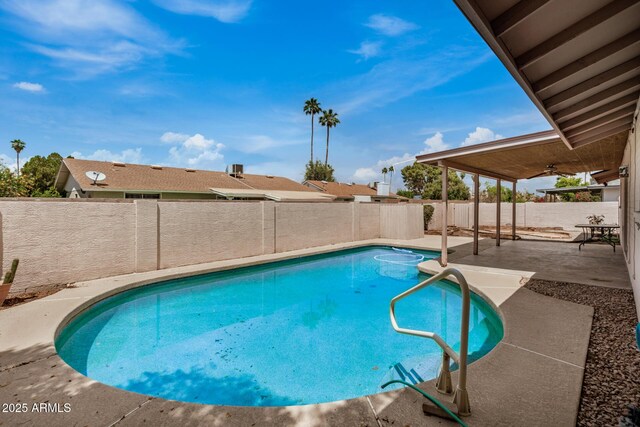 view of pool featuring a patio, a fenced backyard, and ceiling fan