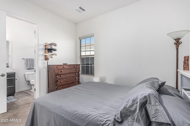 7813 S 43rd Pl, Phoenix, AZ 85042 - bedroom with wood finished floors and ensuite bathroom