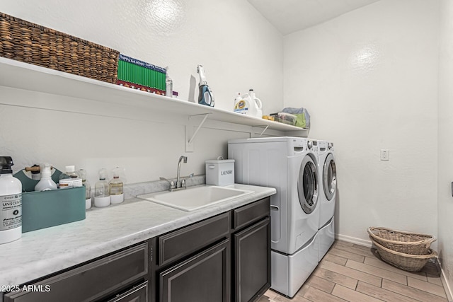 7813 S 43rd Pl, Phoenix, AZ 85042 - laundry area with washing machine and clothes dryer, wood finish floors, baseboards, and cabinet space