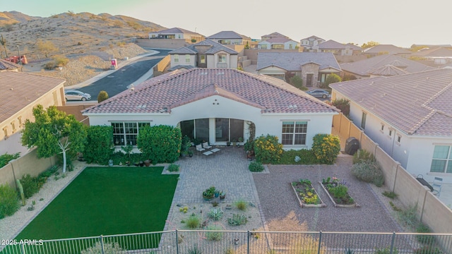 7813 S 43rd Pl, Phoenix, AZ 85042 - rear view of house with a tile roof, stucco siding, and a residential view