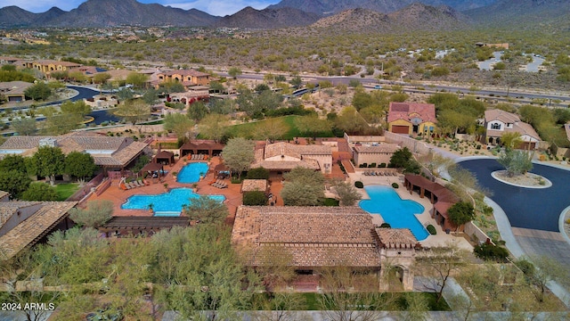 birds eye view of property with a mountain view