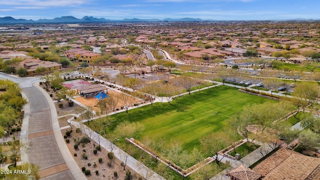 birds eye view of property with a mountain view