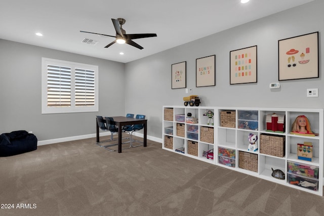 rec room featuring carpet and ceiling fan