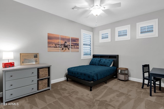 bedroom with light carpet and ceiling fan