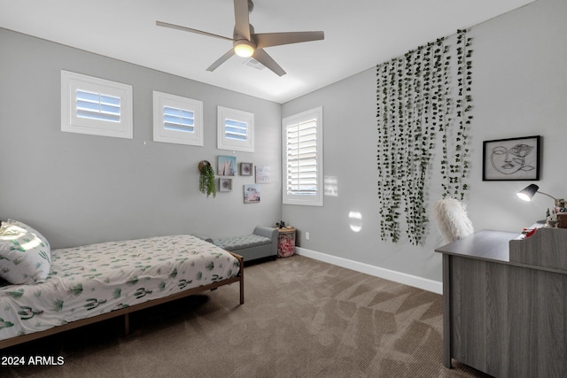 bedroom with ceiling fan and carpet floors