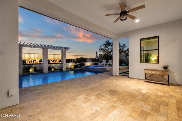 pool at dusk with ceiling fan