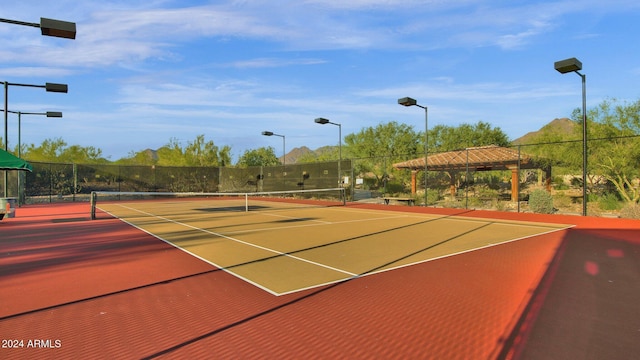 view of sport court with basketball hoop