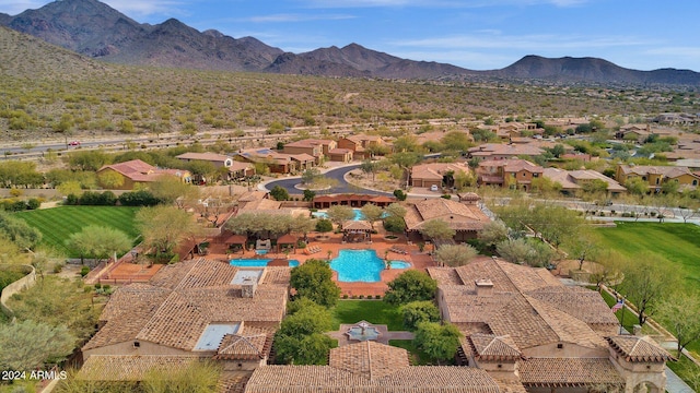 birds eye view of property featuring a mountain view