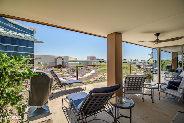 view of patio / terrace featuring ceiling fan and a balcony