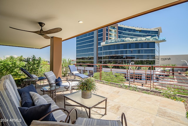 view of patio with outdoor lounge area, ceiling fan, and a balcony