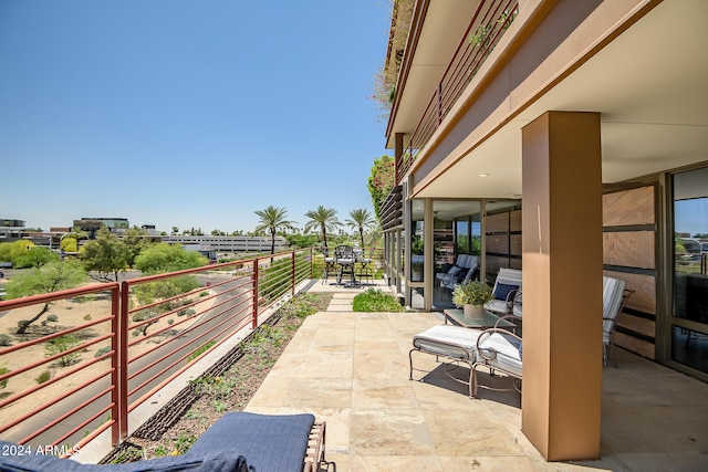 view of patio with a balcony