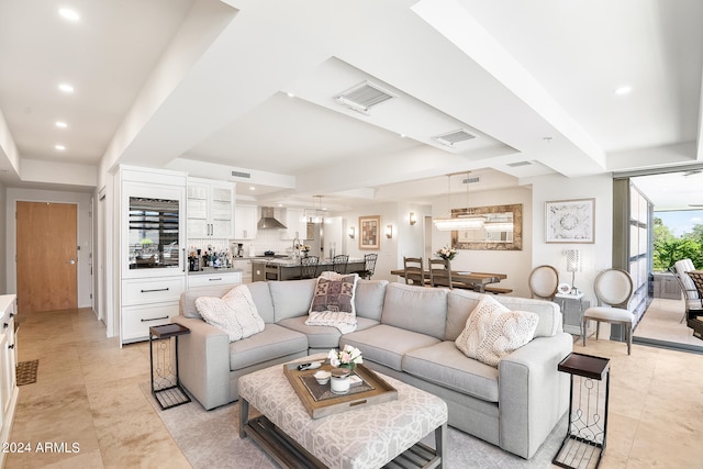 tiled living room with a tray ceiling