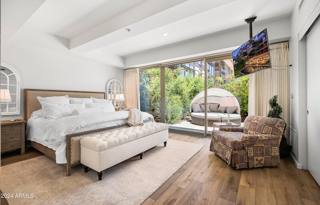 bedroom with hardwood / wood-style floors