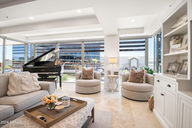 living room featuring floor to ceiling windows and a wealth of natural light