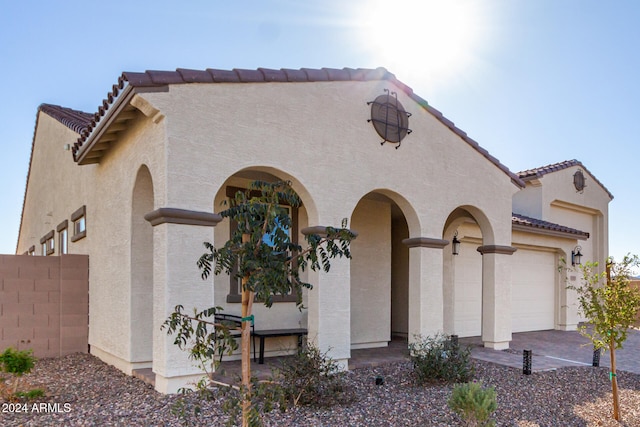 mediterranean / spanish-style house featuring a garage