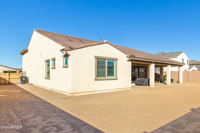 back of property featuring a patio area