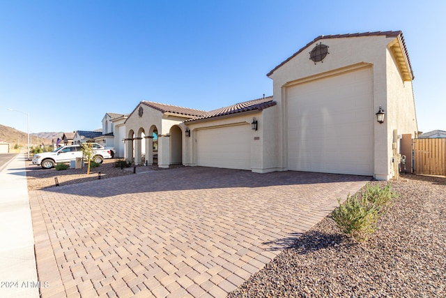 mediterranean / spanish-style house featuring a garage