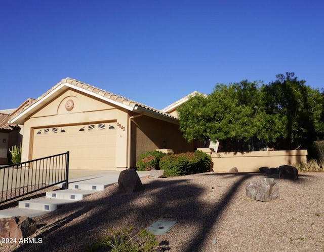 view of front of home with a garage