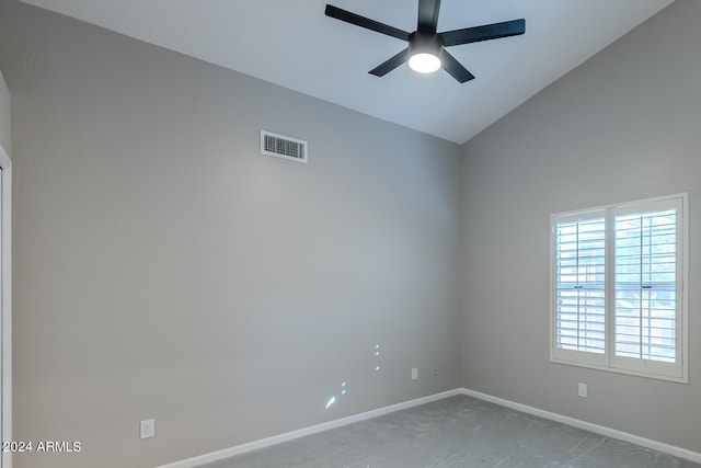 empty room with ceiling fan, carpet floors, and high vaulted ceiling