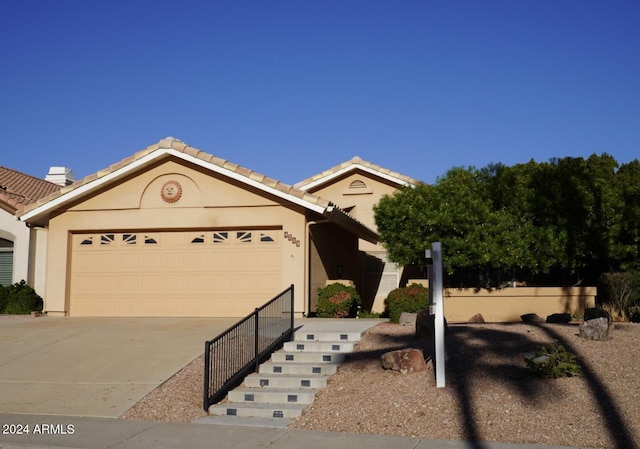 view of front of property with a garage