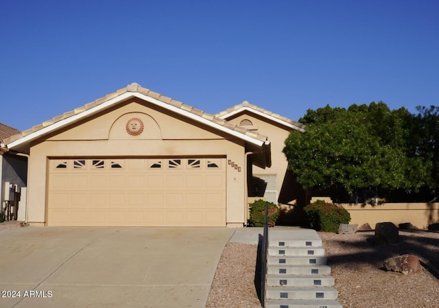 ranch-style home with a garage