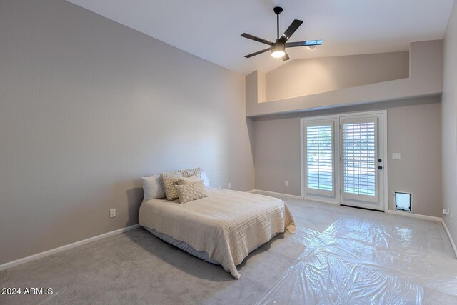 bedroom featuring ceiling fan, lofted ceiling, light carpet, and access to outside