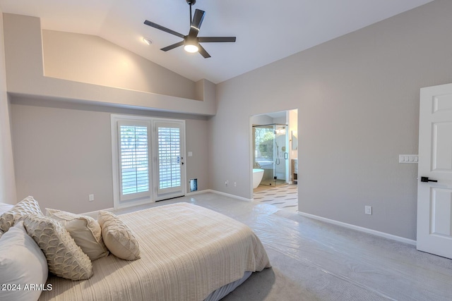 carpeted bedroom with ensuite bath, ceiling fan, and high vaulted ceiling