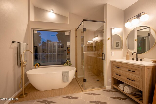 bathroom featuring vanity, tile patterned floors, and independent shower and bath