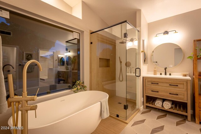 bathroom with vanity, separate shower and tub, and tile patterned floors