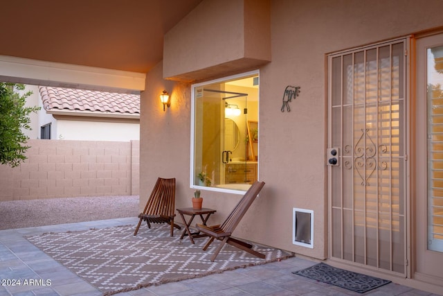 doorway to property with a patio area