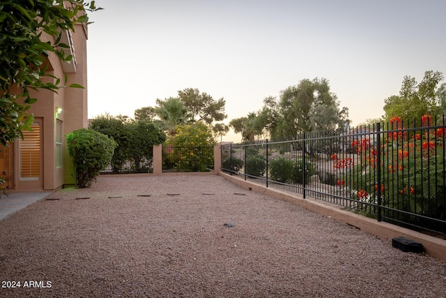 view of yard at dusk