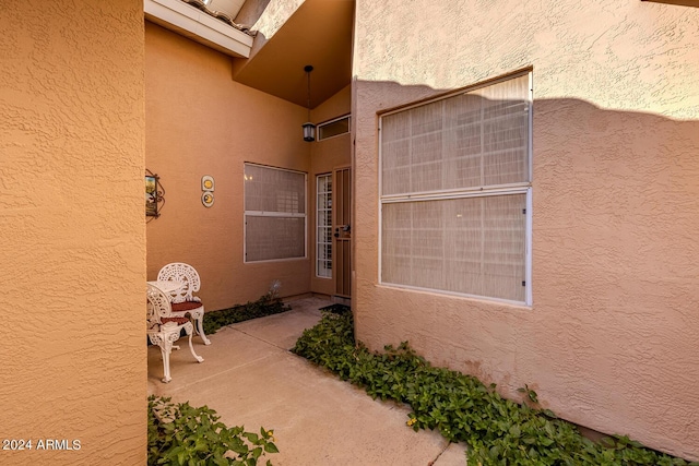 doorway to property with a patio area