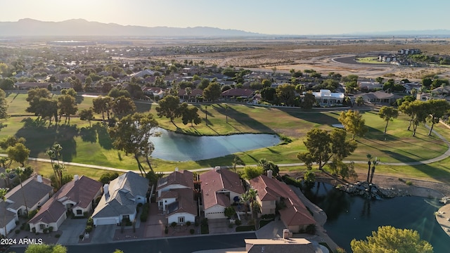 aerial view featuring a water and mountain view