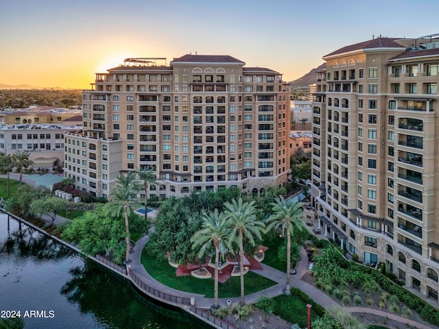 outdoor building at dusk featuring a water view