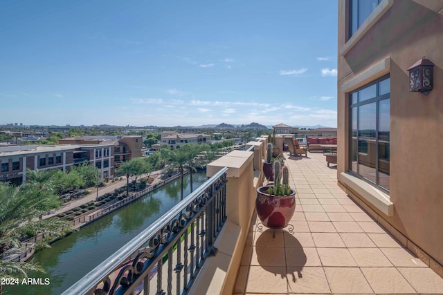 balcony with a water and mountain view