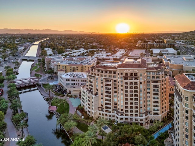 aerial view at dusk with a water view