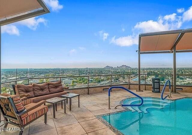 view of swimming pool featuring a patio area and an outdoor living space