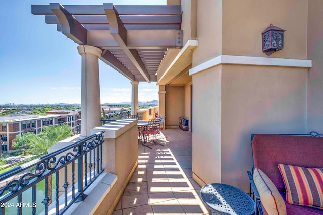 balcony featuring a pergola