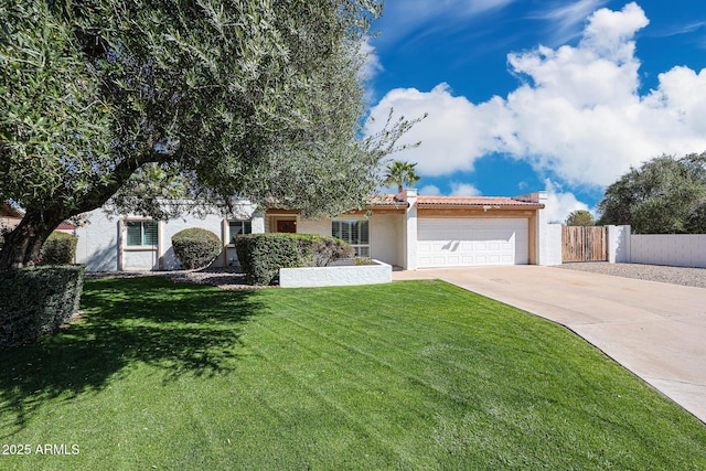 view of front of property featuring stucco siding, concrete driveway, a front yard, an attached garage, and a tiled roof