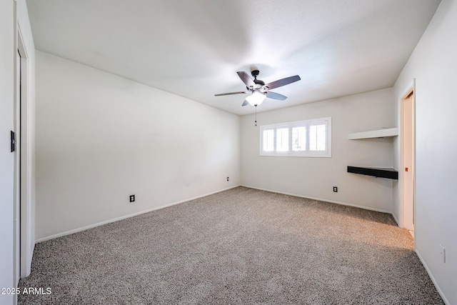 unfurnished bedroom featuring a ceiling fan, baseboards, and carpet floors