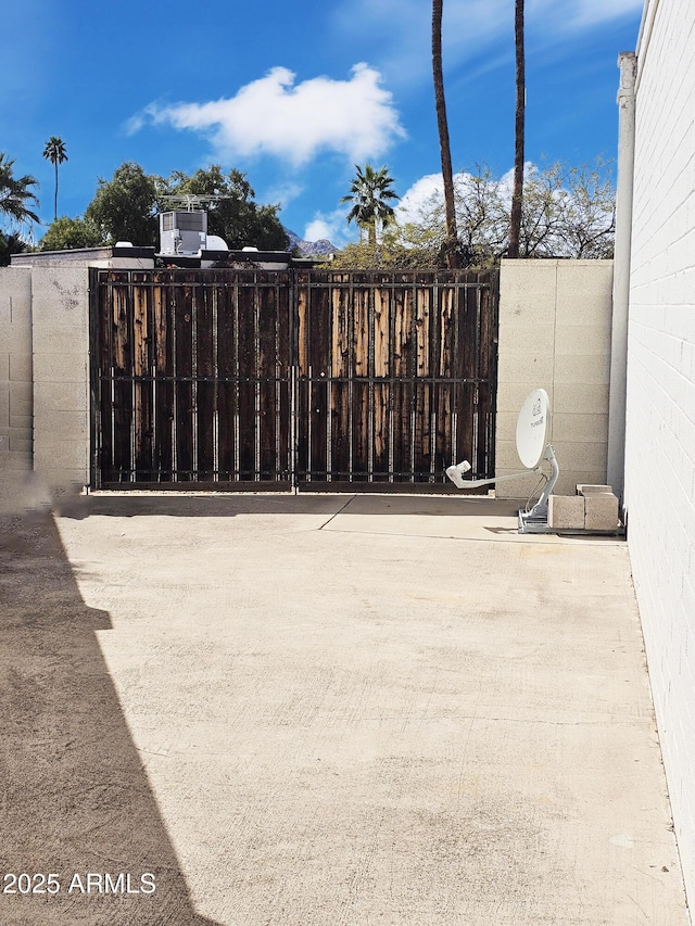 view of gate featuring fence