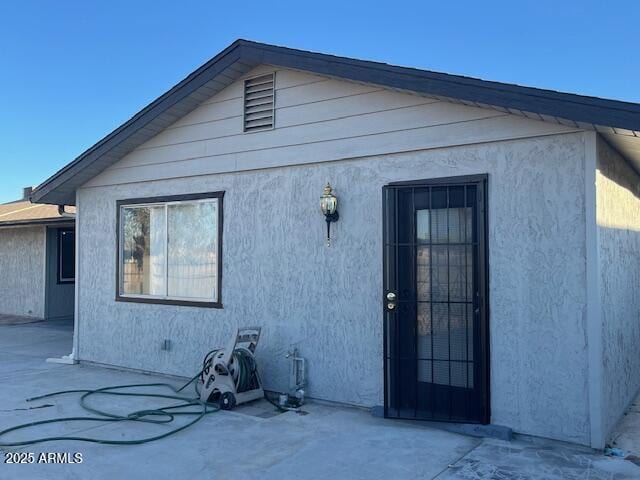 back of house with a patio area