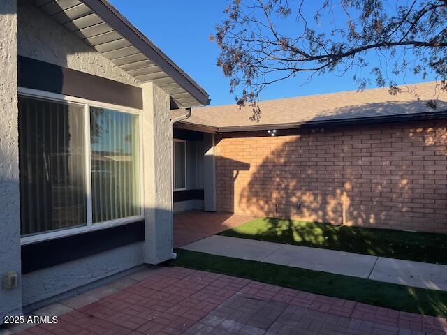 view of home's exterior featuring a patio area