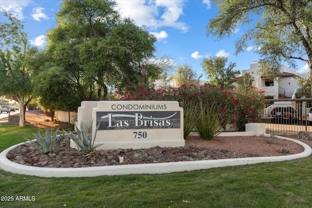 community sign with fence