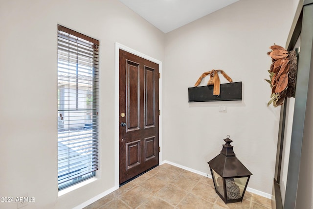 foyer entrance with baseboards